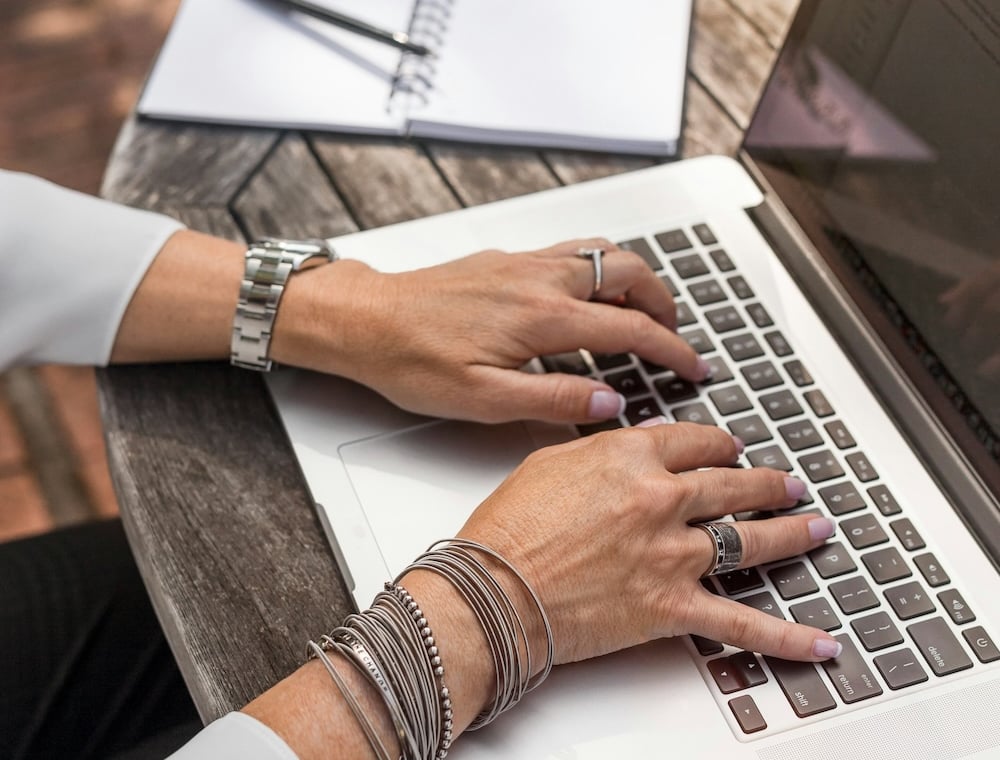Entering details on a laptop
